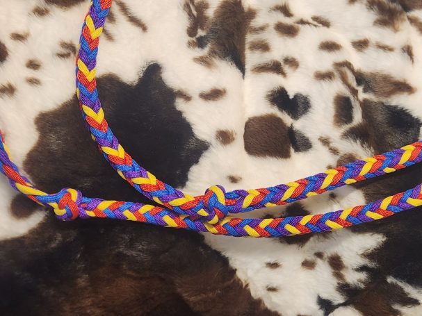 8 plait reins with blue, red, yellow and purple. 8 cords flat with knots and an 8 square plait in between.