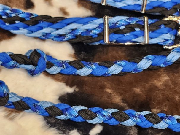 8 plait reins with royal blue, carolina blue, black and blue blends. 8 cords flat with knots and a double 4 round plait in between.